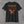 Back of the black Honor the Tradition tee: eagle over flag stripes with EST. 2026 and Truck Co. Apparel in tan and brick red