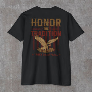 Back of the black Honor the Tradition tee: eagle over flag stripes with EST. 2026 and Truck Co. Apparel in tan and brick red