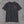 Front of the charcoal Truck Co. Apparel tee with the round TCA ladder-and-hook crest on the left chest