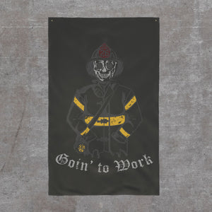 Goin' to Work firehouse flag, 36 by 60: skeleton firefighter in full turnout gear on a dark ground with Goin' to Work in blackletter