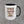 The 15 oz Honor the Tradition accent mug showing the full eagle and flag artwork with Truck Co. Apparel beneath