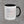 Truck Co. Hook Flag mug, white ceramic with black interior and handle, roof-hook American flag wrapped around the body