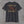 Back of the heather charcoal Truck Co. Apparel vintage logo tee: TCA crest between a crossed ladder and pike pole, two stars, EST. 2026