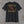 Back of the black Truck Co. Apparel vintage logo tee, tan and brick red TCA crest with crossed ladder and pike pole