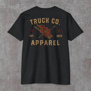Back of the black Truck Co. Apparel vintage logo tee, tan and brick red TCA crest with crossed ladder and pike pole
