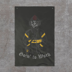 Goin' to Work firehouse flag, 24 by 36: skeleton firefighter in helmet and turnout gear with yellow reflective striping above Goin' to Work in blackletter