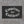 The larger 36 by 60 Competence over Confidence flag on a concrete wall, Truck Co. Apparel mark in the lower corner