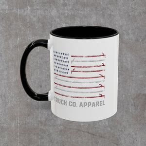 Hook Flag mug seen with the black C-handle on the left, Truck Co. Apparel lettering beneath the flag