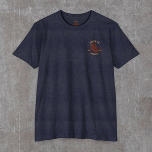 Heathered navy 9/11 memorial tee, front with a small rust-red Truck Co. Apparel skyline crest on the left chest