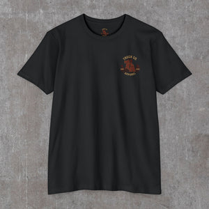 Black 9/11 memorial tee, front with a small rust-red Truck Co. Apparel skyline crest on the left chest