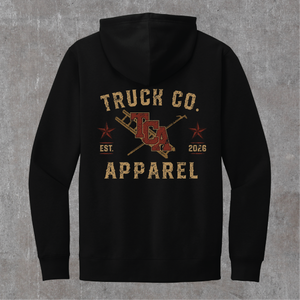 Back of the black Truck Co. Apparel vintage logo hoodie: TCA crest between a crossed ladder and pike pole, two stars, EST. 2026