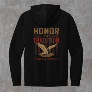 Back of the black Honor the Tradition hoodie: eagle over flag stripes with EST. 2026 and Truck Co. Apparel in tan and brick red