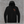 Front of the black Honor the Tradition hoodie with the TCA monogram on the left chest