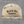 Richardson 168P seven-panel trucker hat in Harvest Duck Camo and sandstone, Truck Co. Apparel embroidered in black blackletter across the front panel