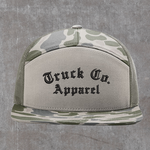 Richardson 168P seven-panel trucker hat in Marsh Duck Camo and loden, Truck Co. Apparel embroidered in black blackletter across the front panel