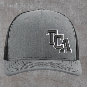 Richardson 112 trucker hat in heather grey with black mesh, TCA monogram embroidered in charcoal with a white outline on the left front panel