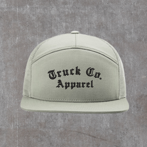 Richardson 168 seven-panel trucker hat in Quarry, a pale grey-green, with Truck Co. Apparel embroidered in black blackletter across the front panel